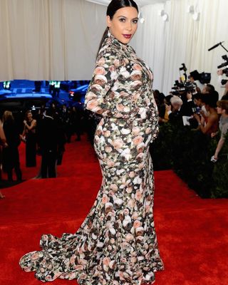 Image may contain Kim Kardashian Fashion Adult Person Wedding Clothing Dress Car Transportation and Vehicle