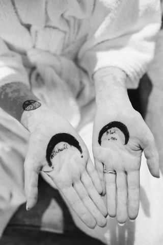 Image may contain Body Part Finger Hand Person Skin Tattoo and Baby