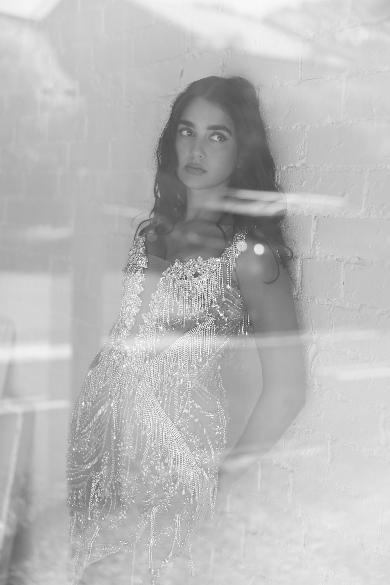 Image may contain Face Head Person Photography Portrait Clothing Dress Formal Wear Fashion Body Part and Finger