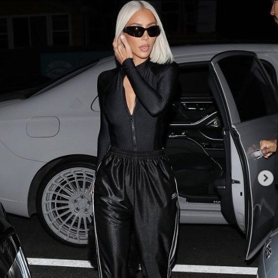 Kim Kardashian elevates classic track pants with unexpected shoes