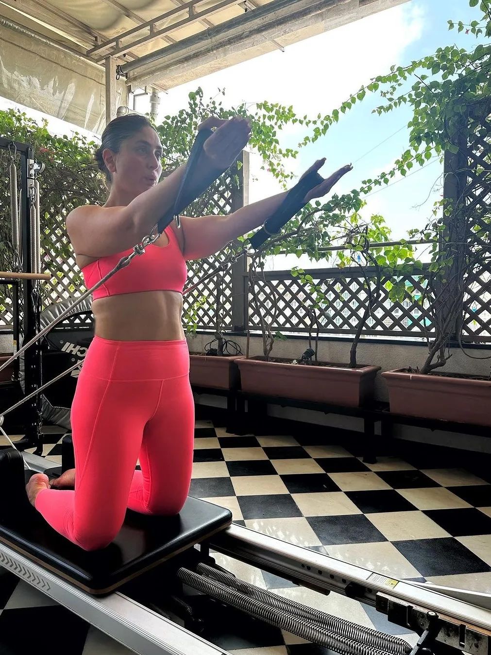 Image may contain build muscle Kareena Kapoor Fitness Pilates Sport Working Out Adult Person Bicycle Transportation and...