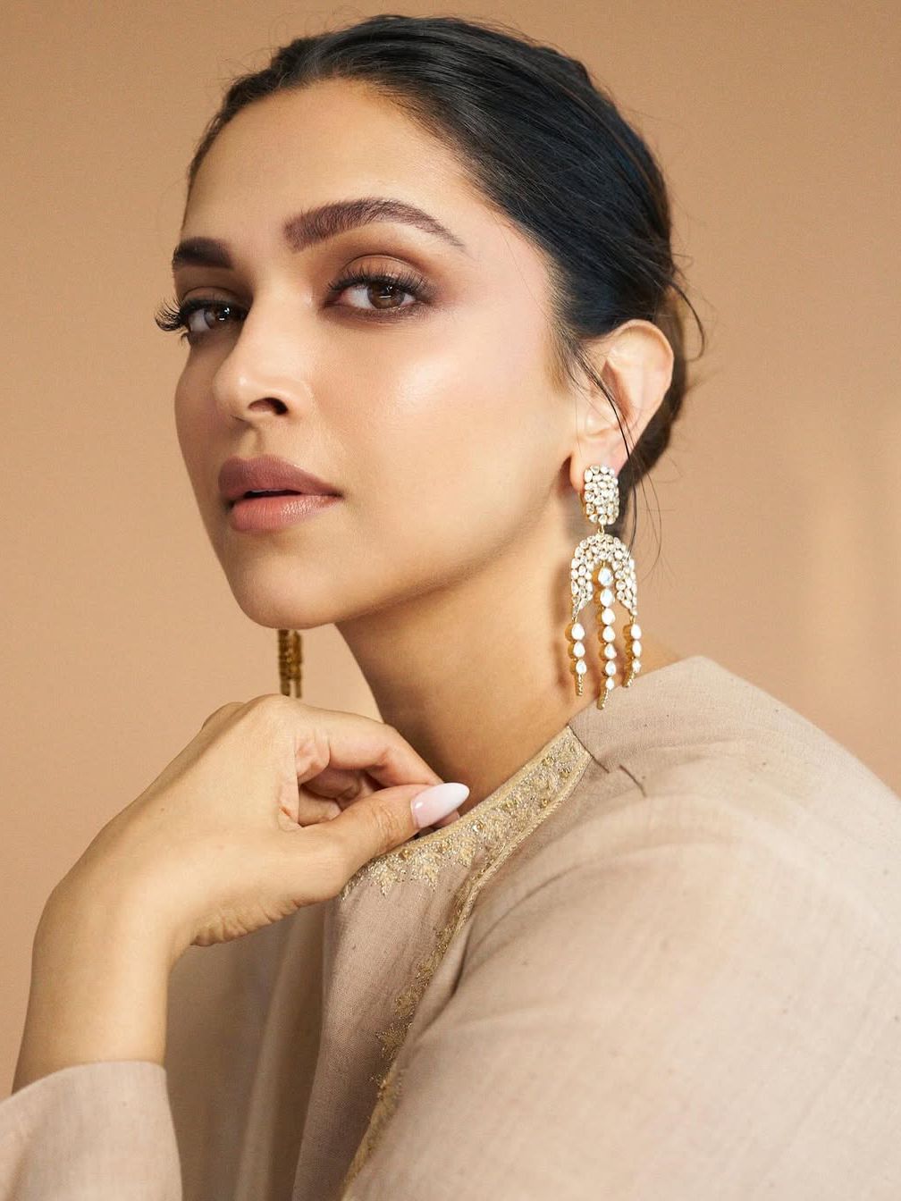 Image may contain Deepika Padukone Head Person Face Body Part Neck Accessories Earring Jewelry and Photography